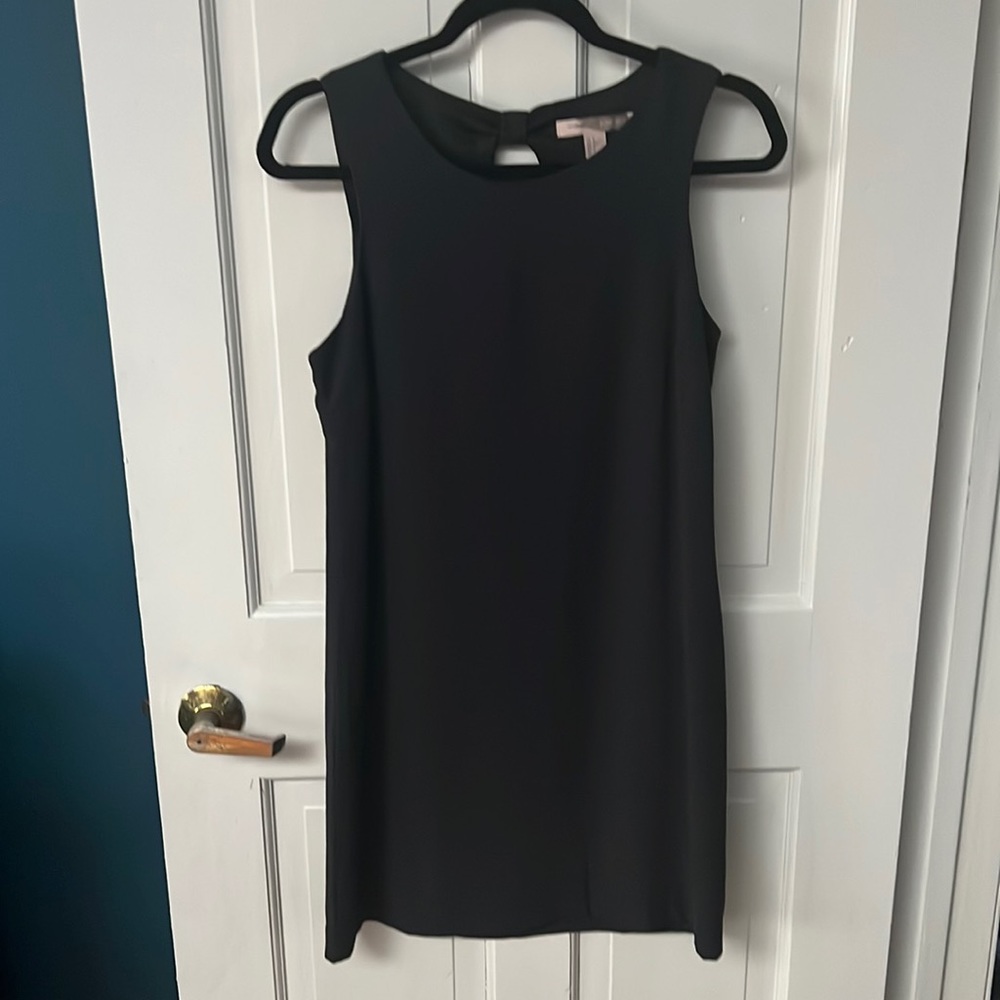 Forever21 small black dress with open back with a black bow